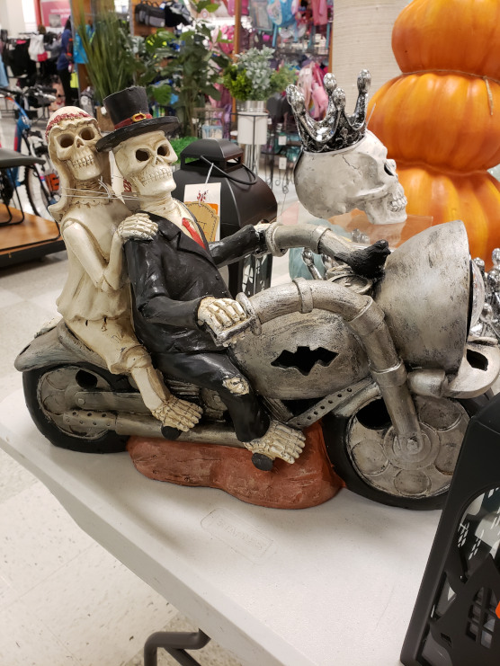 Skeleton couple on a motorcycle